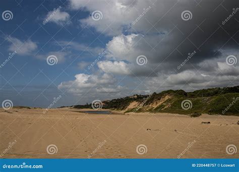 Stretch of Beach with River Mouth in the Distance Stock Image - Image of horizon, sunny: 220448757