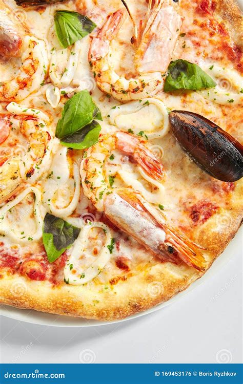 Italian Seafood Pizza With Squid Mussels And Shrimps Stock Photo