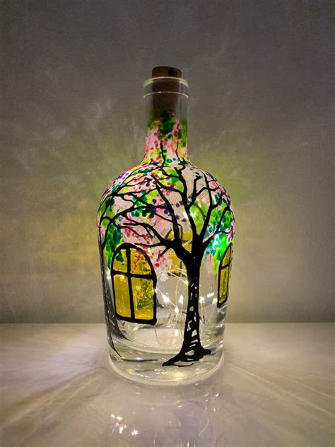 Recycled bottles that I hand paint with acrylic paint. A 6' string of fairy lights with cork is ...