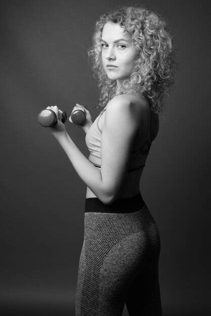 Premium Photo Portrait Of Beautiful Woman Standing Against Black