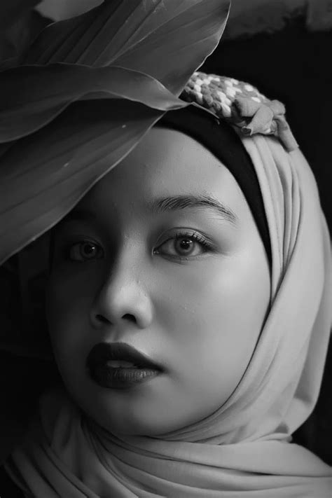 Black And White Photograph Of A Woman Wearing A Headscarf