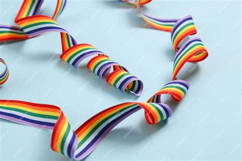 Premium Photo | Rainbow lgbt ribbon on blue background