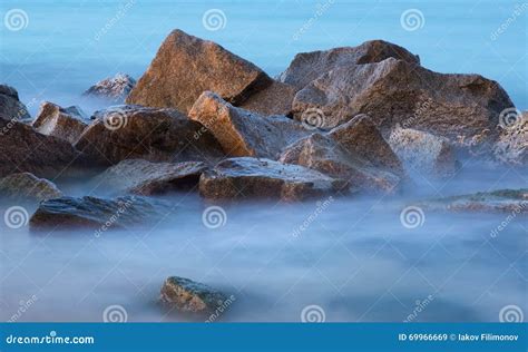 Sea Rocks In Mist At Dusk Stock Image Image Of Shore 69966669