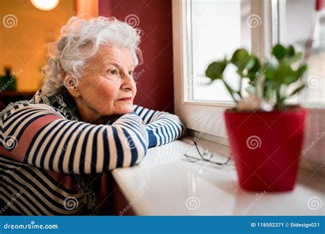 Sad Alone Senior Woman Looking Through Window Stock Image Image Of