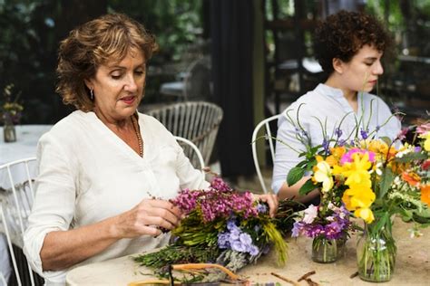 Premium Photo Women Arranging Flowers