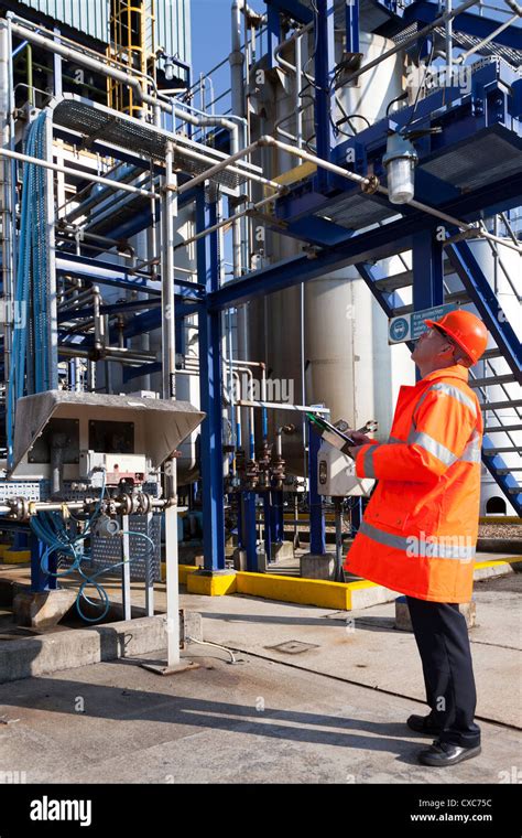 chemical plant process operator worker checking safety check protective