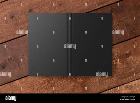 Blank black vertical open and upside down book cover on wooden boards ...