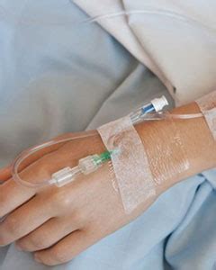 Intravenous Therapy In A White Hospital Hand With A Off