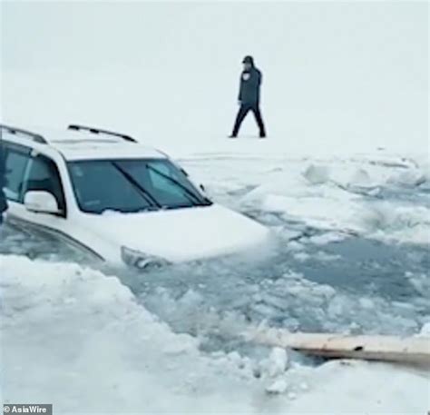 Horrifying Moment Ice Cracks As Couple Drive On Frozen Lake In China Daily Mail Online