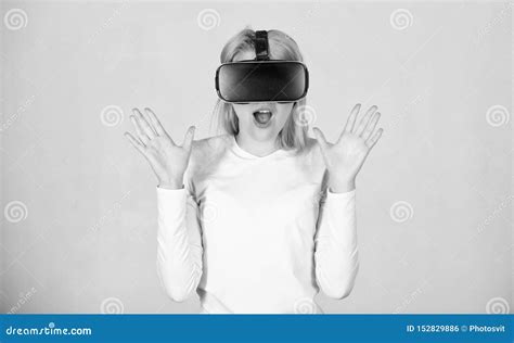 Beautiful Woman Wearing Virtual Reality Goggles In Studio Woman Using