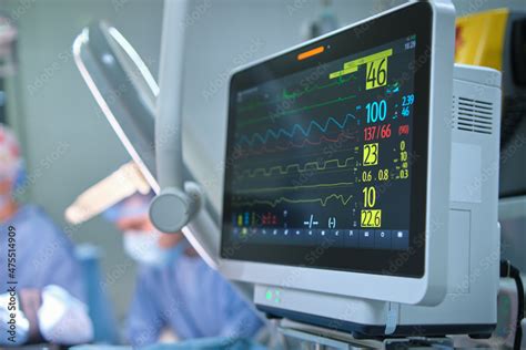 Heart rate and patient control monitor in hospital theater room during ...