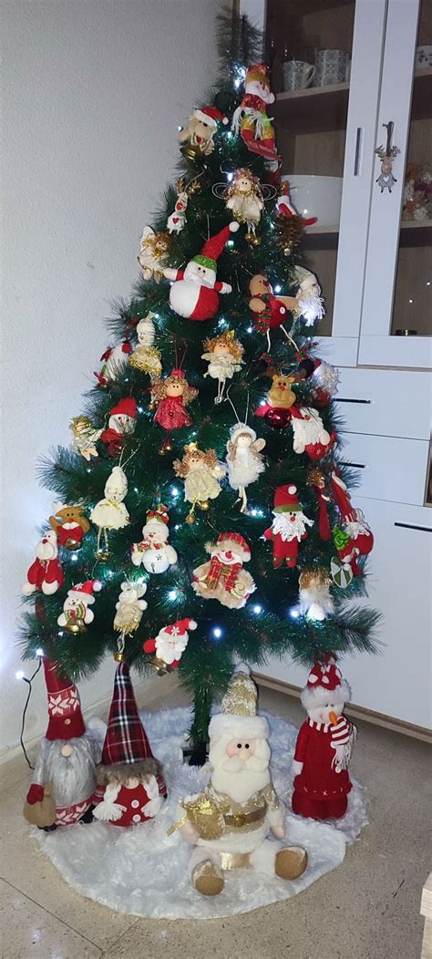 A Christmas Tree Decorated With Ornaments And Lights