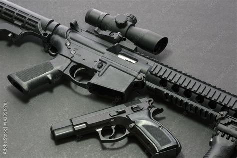 Assault rifle with handgun and ammunition. Military weapon Stock Photo ...