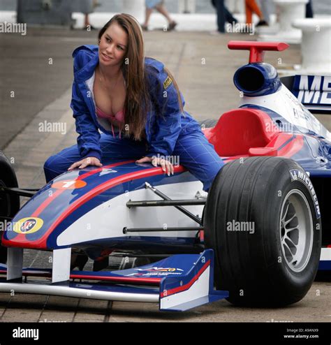 Racing Cars And Sex A Model Poses For Photographers On The Bonnet Of