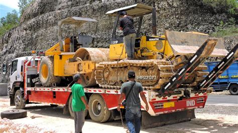 Double Load Compactor And Bulldozer Onto Self Loader Truck Youtube