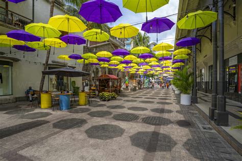 View Of Umbrellas And Shops At Caudan Waterfront In Port Louis Port