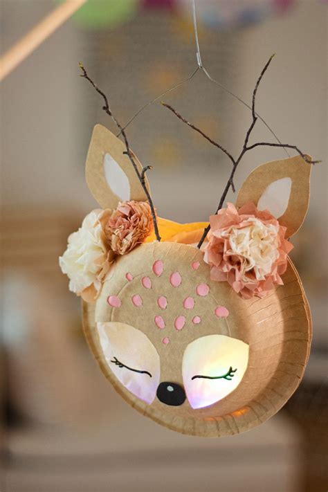 A Paper Plate Shaped Like A Deer With Flowers On Its Head And Antlers