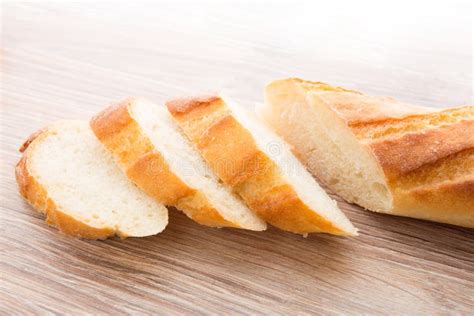 Slices of baguette stock photo. Image of delicious, paper - 32844420