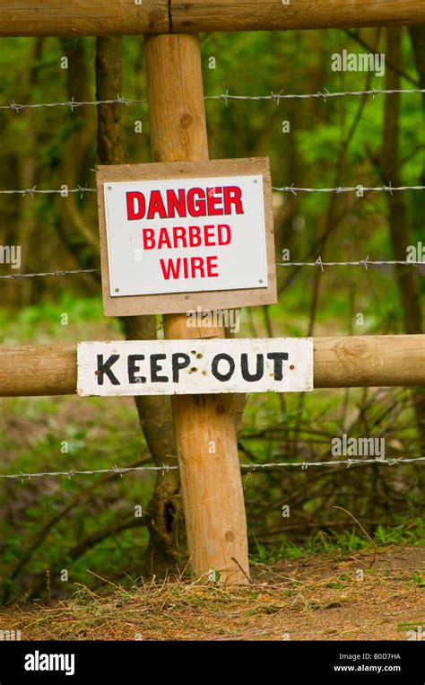 Danger Barbed Wire Sign Portrait Photograph Stock Photo Alamy