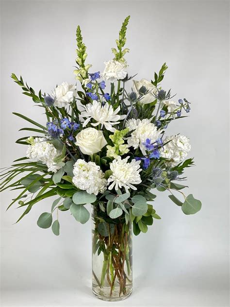 This Vase Arrangement Created With Gorgeous White Blue Florals