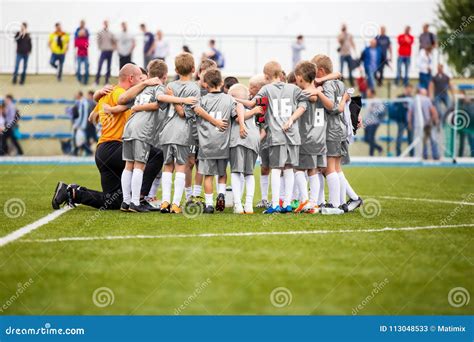 Football Coaching. Young Boys Having Pep Talk With Coach Before The Tournament Match. Kids ...