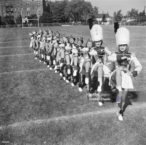 Eleven American high school baton twirlers and two drum majorettes ...