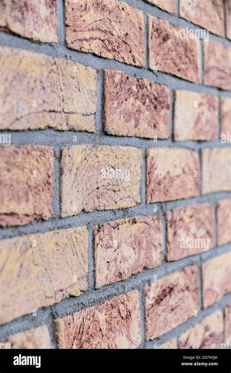 Red brick wall, stretcher bond, simplest repeating pattern of brickwork, rows of bricks, side ...