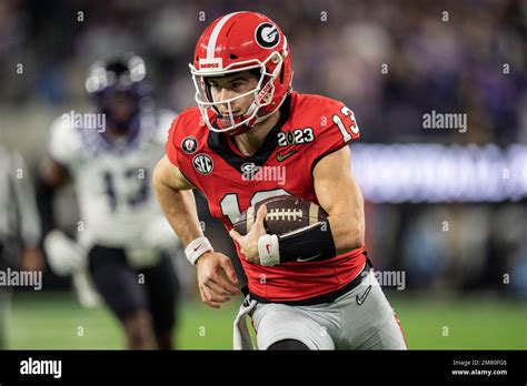 Georgia Bulldogs quarterback Stetson Bennett (13) runs the ball for a touchdown during the ...