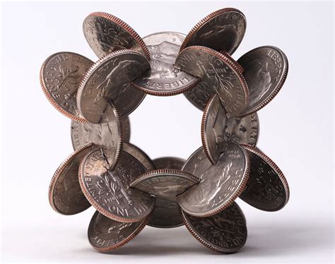 Interlocked Coins Form Complex Geometric Sculptures