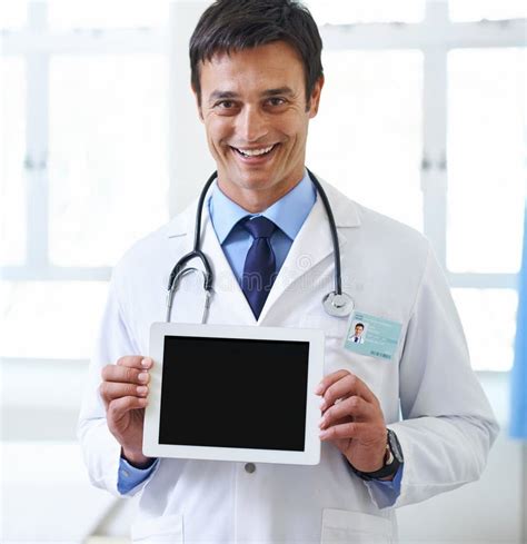 Portrait Doctor And Man With Tablet Screen And Show With Smile In Hospital Proud And Display