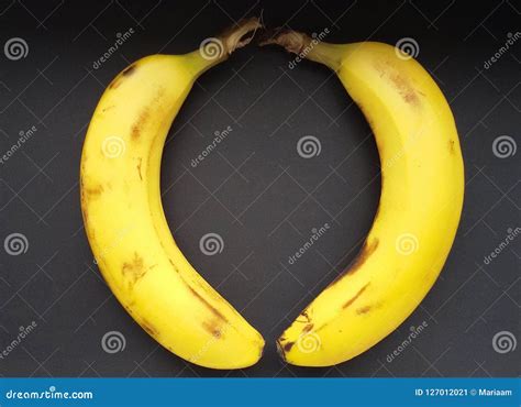 Ripe Bananas in Heart Shape Over Black. Bananas on a Black Table. Stock ...