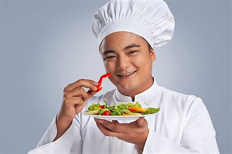 Chef Adding A Garnish To A Plate Of Food Background Plating Food