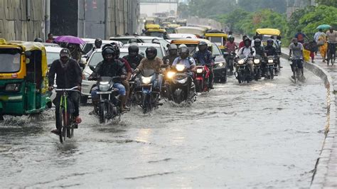 Heavy Rain Lashes Delhi Ncr Imd Predicts Thundershowers Cloudy Sky