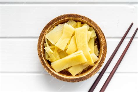 Premium Photo Sliced Canned Bamboo Shoots In Wooden Bowl