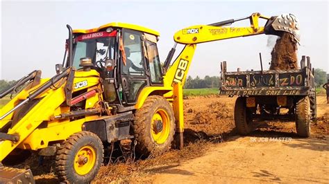 Jcb Dx Backhoe Loader Machine Loading Mud In Mahindra Di