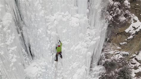 Ice Climber On Frozen Waterfall Stock Video Clip K