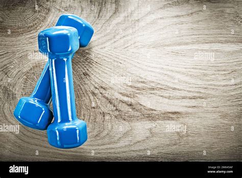 Pair Of Blue Dumbbells On Wood Board Copy Space Fitness Concept Stock