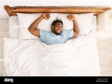 Man Sleeping Smiling Bed Hi Res Stock Photography And Images Alamy