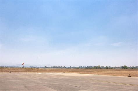 Premium Photo | Runway of small airport shot against a backdrop of blue sky