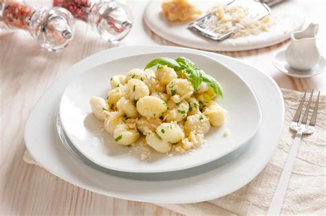 Premium Photo Traditional Homemade Cooked Italian Potato Gnocchi With Butter Parsley And