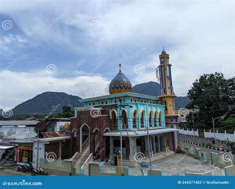 Masjid At Taqwa Mosque With Its Golden Dome And Palm Trees Miri City