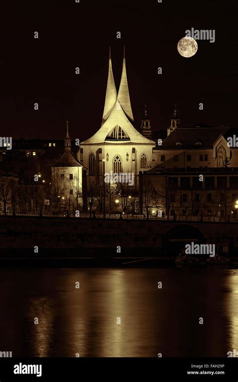 Antique City Of Prague At Night With The River Vltava In Sepia Tone