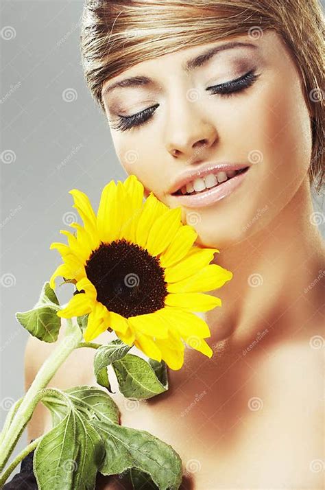 Beautiful Woman With A Sunflower Stock Image Image Of Beautiful