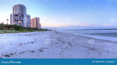 Sunrise Over the White Sand of Vanderbilt Beach in Naples Stock Photo ...