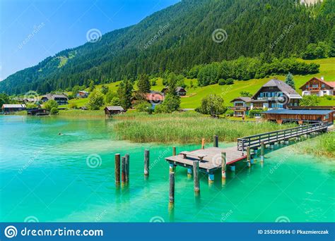 Pier On Turquoise Colour Weissensee Alpine Lake In Summer Landscape Of