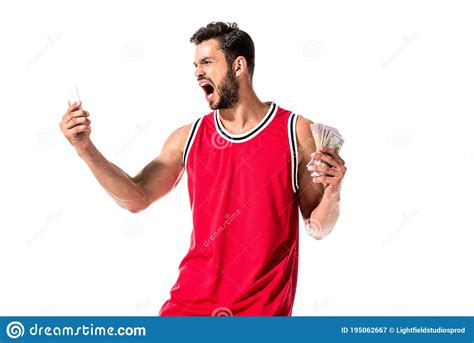 Angry Basketball Player Holding Money And Smartphone Stock Image