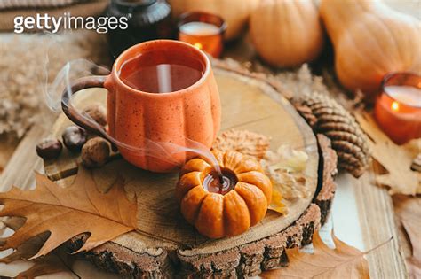 Smoke From An Extinguished Candle And A Cup Of Tea Autumn Composition