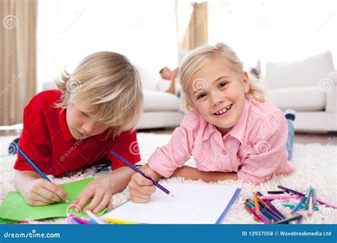 Cheerful Children Drawing Lying On The Floor Stock Photo Image Of