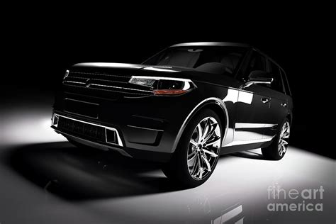 Modern Black SUV Car In A Spotlight On A Black Background Photograph