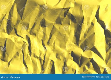 Defocused Image Of Yellow Crumpled Paper Texture Abstract Backdrop